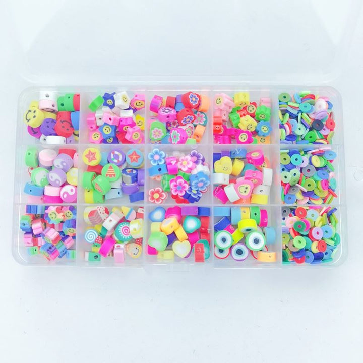 The Fashiongirl Clay Beads / Heishi Beads Fimo Kit - KREA DIY Jewellery Kit includes 4500 colorful beads in assorted shapes like flowers, hearts, stars, fruit slices, and smiley faces in a 15-compartment plastic organizer—perfect for jewellery making.