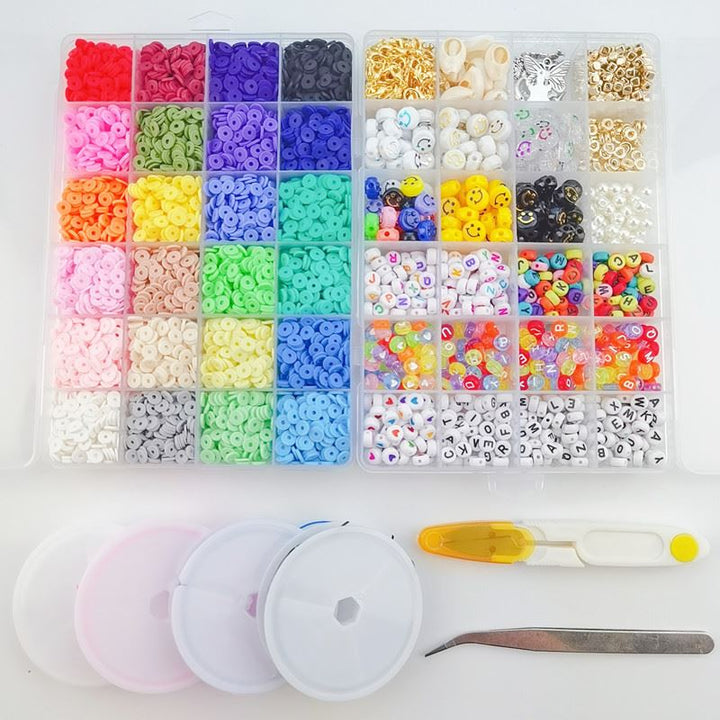 The Fashiongirl Clay Beads / Heishi Beads Merkki Kit - KREA DIY Jewellery Kit includes 7000 colorful, assorted beads sorted in an organizer box with three empty containers, a yellow-handled needle, and metal tweezers on a white surface.