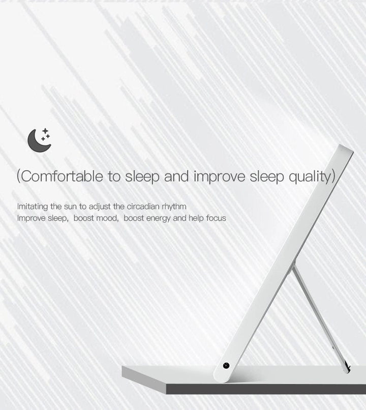 A sleek Fashiongirl Light Therapy Lamp 10,000 lux LED in white stands angled upward, offering artificial daylight to improve sleep, mood, energy, and focus for better circadian rhythm. Subtle gray lines accent the background.