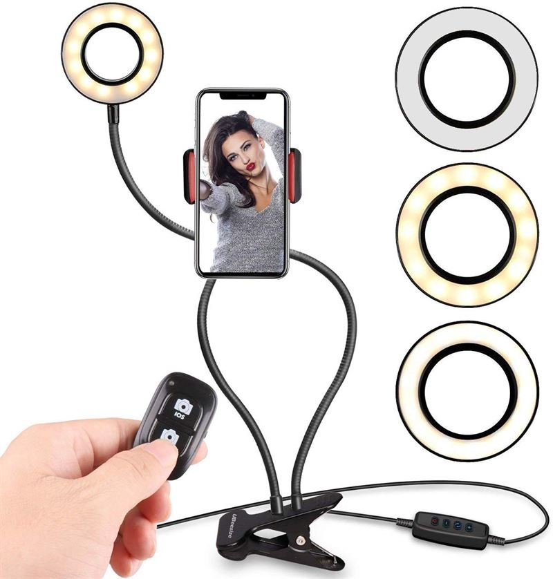 The UNIQ Selfie Ring Light features adjustable LED brightness, flexible arms, a remote, clip-on base, and cable controls—ideal for streaming, vlogs, YouTube, or makeup—with three color modes: white, warm, and neutral.