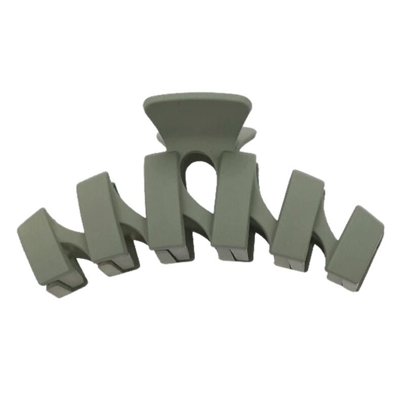 The SOHO Just Hair Claw in matte gray-green features five wide rectangular prongs and a curved shape—an elegant SOHO accessory for effortless hair styling.