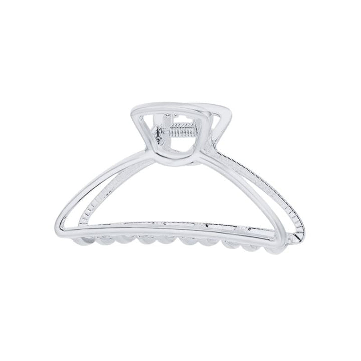 The SOHO Tori Small Metal Hair Claw in matt silver features a spring hinge and ridged teeth for secure messy bun styling—a stylish SOHO accessory shown against a white background.