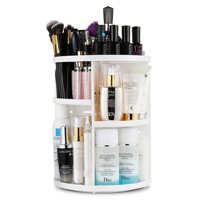 The UNIQ 360° Rotating Makeup Organizer in white by UNIQ neatly stores skincare products, bottles, makeup brushes, and nail polish on multiple shelves. It features a cosmetic storage rack, lipstick holder, and is easy to assemble.