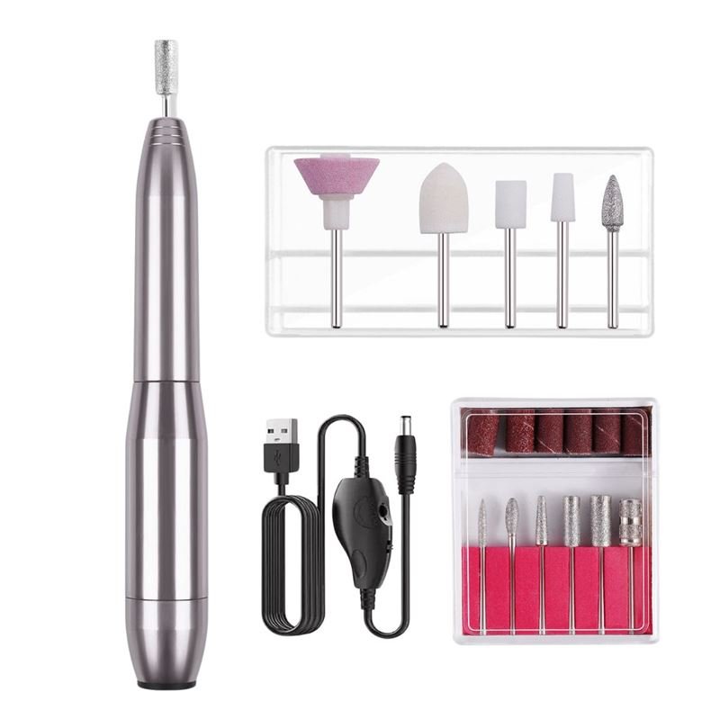 The UNIQ Compact Electric Nail File Kit features a portable metallic pen-shaped e-file, multiple drill bits, sanding bands, USB charging cable, and control switch—perfect for salon-quality manicures and pedicures at home.