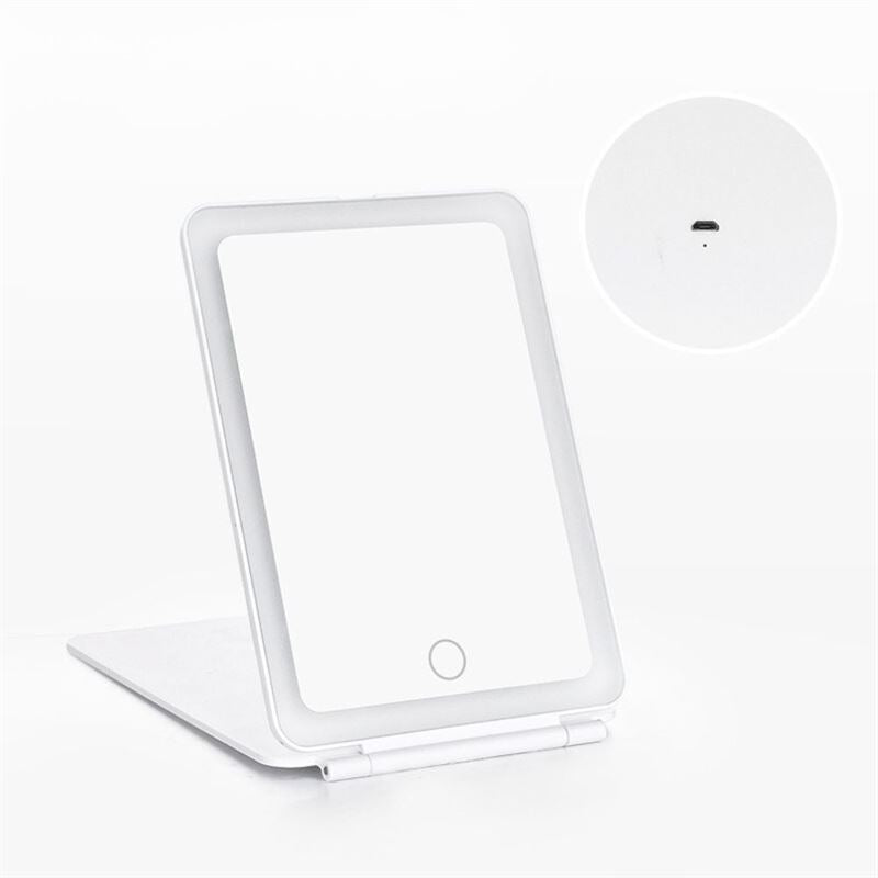 The UNIQ Foldable LED Makeup Mirror by UNIQ is a white, rechargeable mirror with a front touch button and visible charging port, propped open on a flat surface—ideal for travel or daily beauty routines.