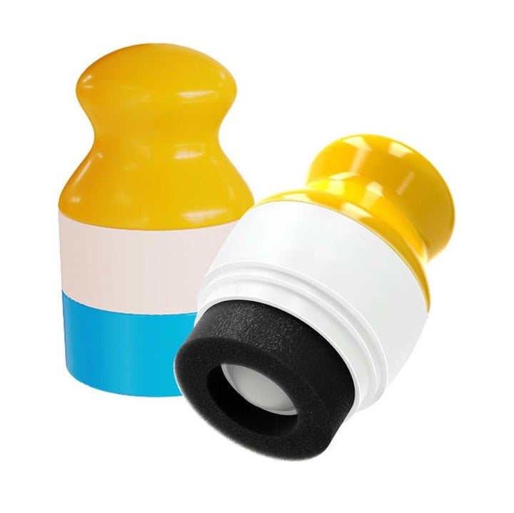 Two UNIQ Portable Refillable Sponge Roller Applicators (100ml) for mess-free sunscreen or lotion are shown: each features a yellow top, blue base, and black sponge; one stands upright while the other reveals the sponge.