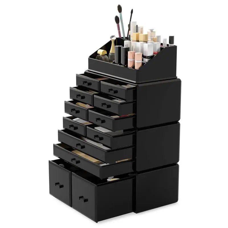 The UNIQ XXL Organiser with 12 drawers and 16 compartments in black neatly holds cosmetics, brushes, and bottles on top. Some drawers are slightly open, showing stored makeup products.
