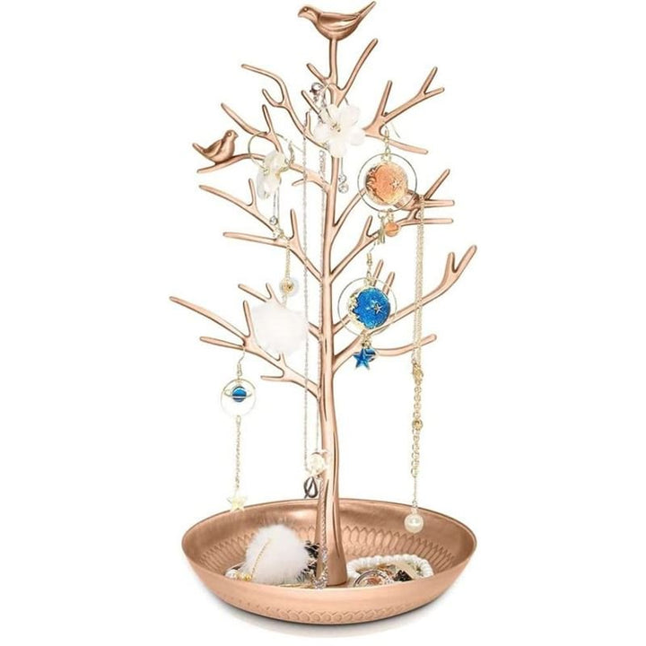 The UNIQ Bronze Vintage Jewelry Tree with 3 Birds is a stainless steel organizer stand for necklaces, bracelets, and earrings, featuring a round tray base for extra storage—a charming addition to your jewelry collection.